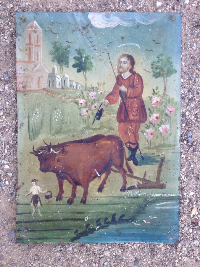 Retablo, painting on metal of San Ysidro plowing with angel, in style of traditional New Mexico folk arts.  From Burns/Drees Collection (Photo MABurgess)