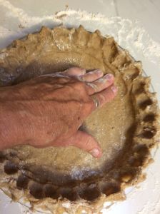 Pressing mesquite/whiteSonora wheat dough into pie pan