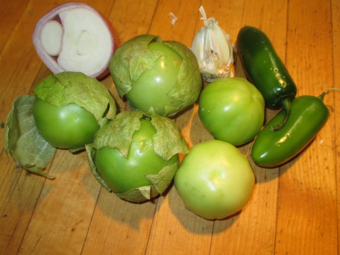 Here are the vegetables you will use: tomatillos, onion, garlic and jalapenos.