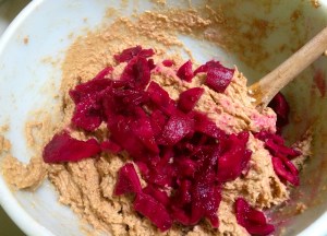 Into the batter go the tuna pieces!